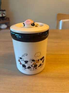 Vintage ceramic canister with cow motif